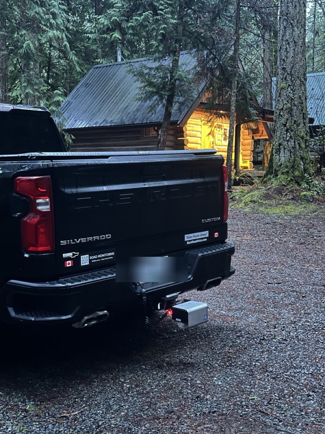 A Scout capture unit hitch-mounted on a pickup at a remote cabin in the British Columbia forest